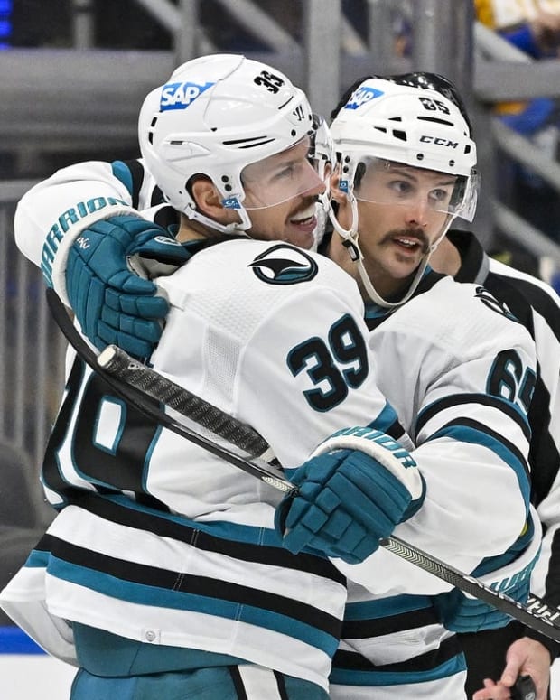 Nov 10, 2022; St. Louis, Missouri, USA; San Jose Sharks center Logan Couture (39) celebrates with defenseman Erik Karlsson (65) after scoring against the St. Louis Blues during the third period at Enterprise Center. Mandatory Credit: Jeff Curry-USA TODAY Sports